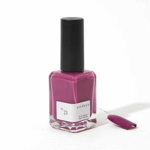 Non-toxic nail polish in magenta